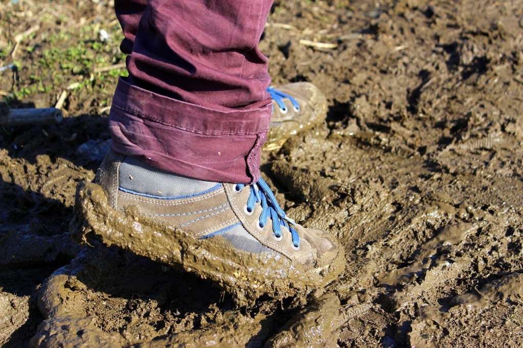 Boots trudging through mud
