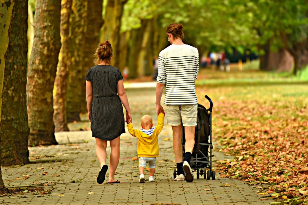 Family with a child walking
