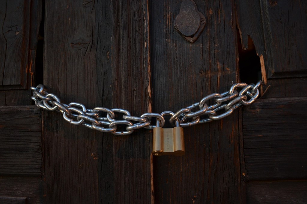 chain and lock through doors to keep shut